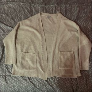 This is a cream white dog fuzzy cardigan!